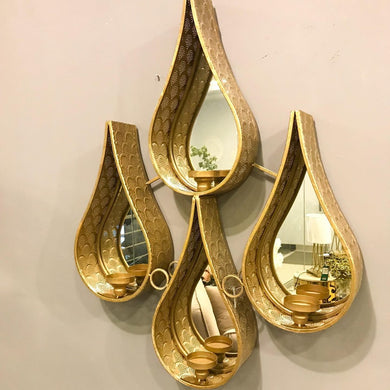 Traditional metallic wall decor with mirror and candle holders